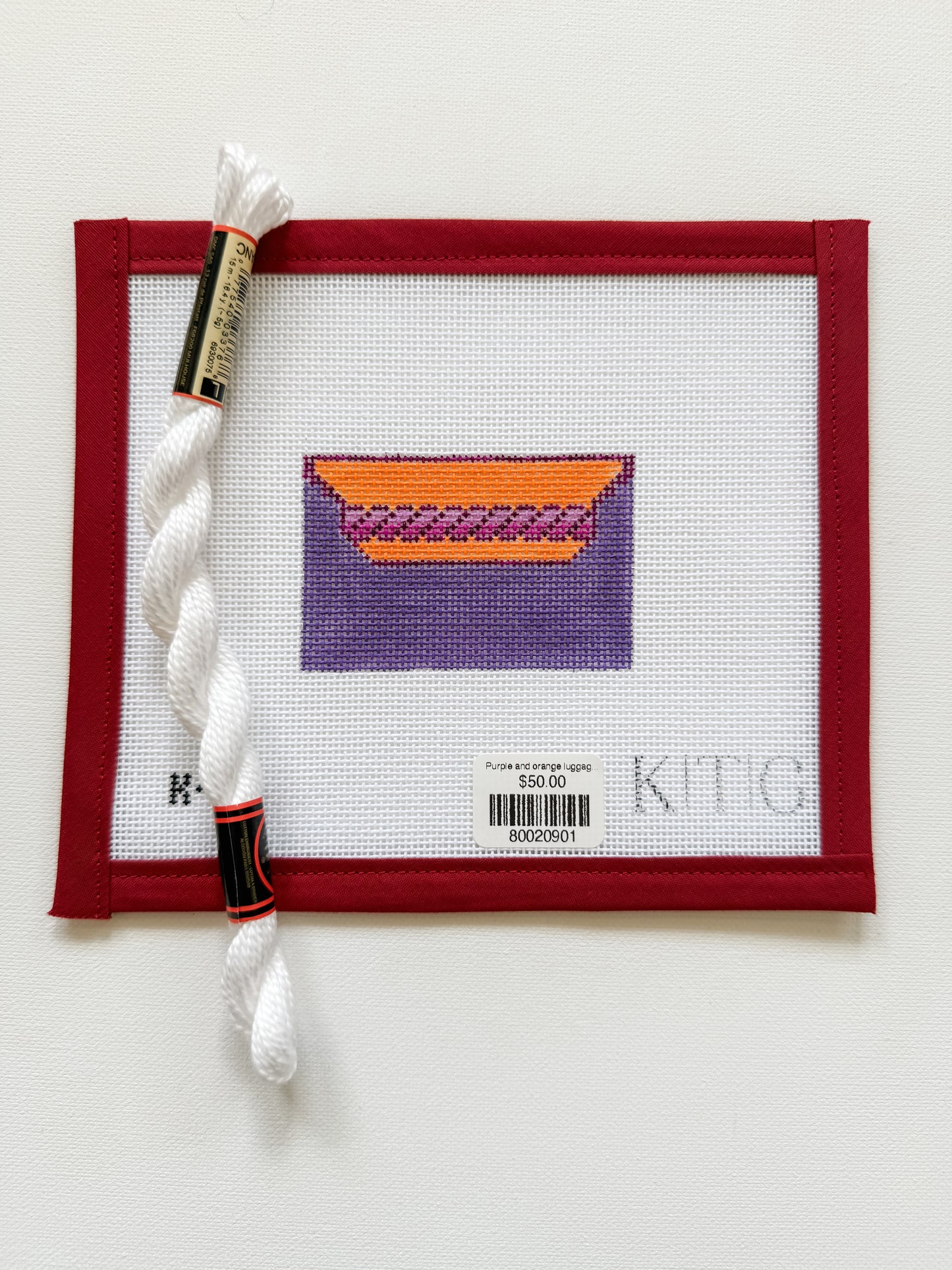 Purple and orange luggage tag