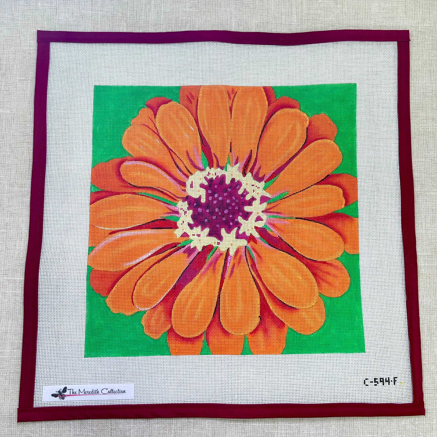 Dark Orange Zinnia on Green Background