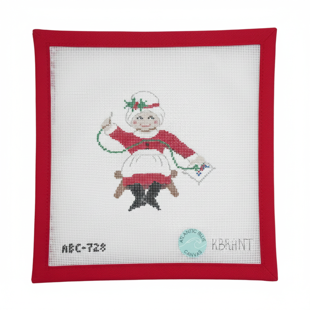 Needlepointing Mrs. Claus
